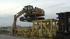 Cat 319d Ln Climbing Onto Rail Car